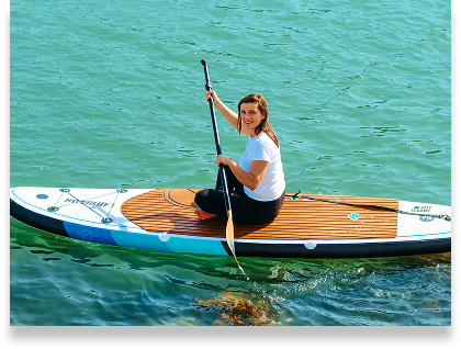 Young Girl Sitting on a Stand Up Paddle Board